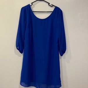 Short bright blue bow back dress